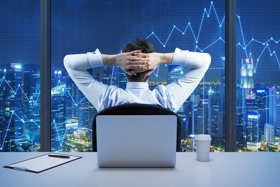 The forex broker diligently analyzing trading charts in pursuit of generating immense wealth.