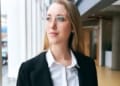 young businesswoman wearing glasses standing modern office health