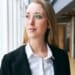 young businesswoman wearing glasses standing modern office health