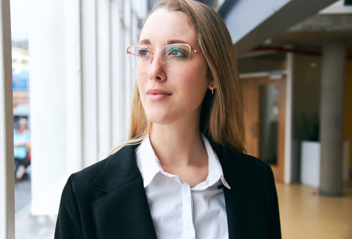 young businesswoman wearing glasses standing modern office health